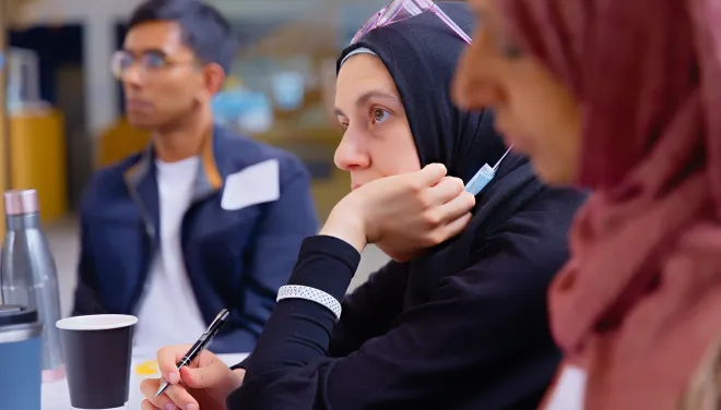 Students listening during a workshop presentation